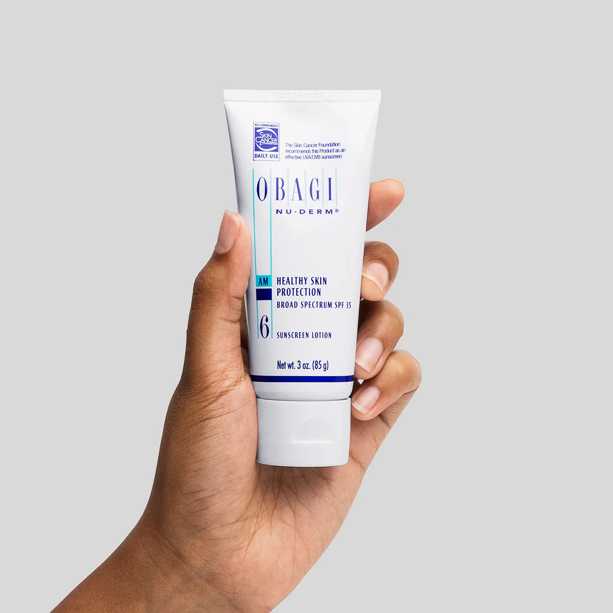 Nu-Derm Healthy Skin Protection Broad Spectrum SPF 35 With Model Hand